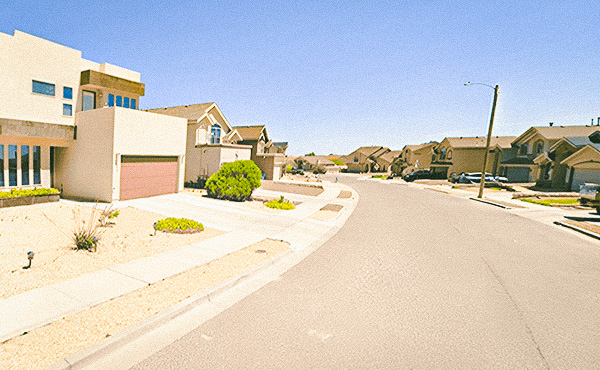 A neighborhood street in El Paso with houses.